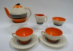 A SUSIE COOPER TEA FOR TWO SET comprising teapot and stand, pair of cups and saucers, cream jug