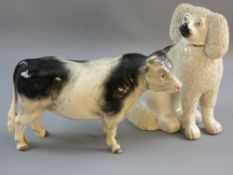 A MELBA WARE STANDING GREY AND WHITE BULL, 30 cms long and a 19th Century Staffordshire pottery