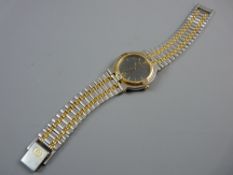 A LADY'S OR GENT'S GUCCI CALENDAR WRISTWATCH, stainless steel and yellow metal decorated having a