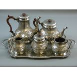 A FIVE PIECE ELECTROPLATED TEA & COFFEE SERVICE, each circular based piece having a band of