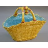 A LARGE OVAL COPELAND POTTERY WOVEN BASKET with intertwined centre handles, 31 x 16 cms