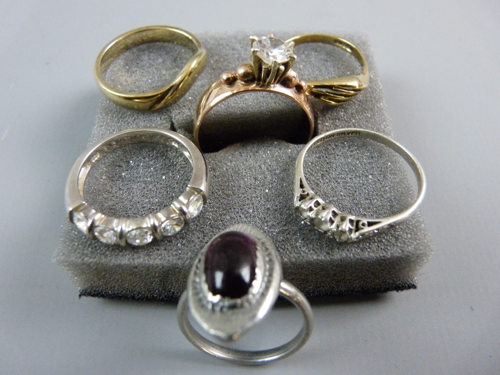 A PARCEL OF SIX ASSORTED RINGS including two nine carat gold, one believed gold but unmarked and one