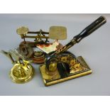 A SET OF BRASS AVERY POSTAL SCALES on a wooden base with five weights, a floral decorated office