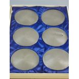 A CASED SET OF SIX SILVER ENGINE TURNED WINE COASTERS, Birmingham 1974 (severe impact damage to