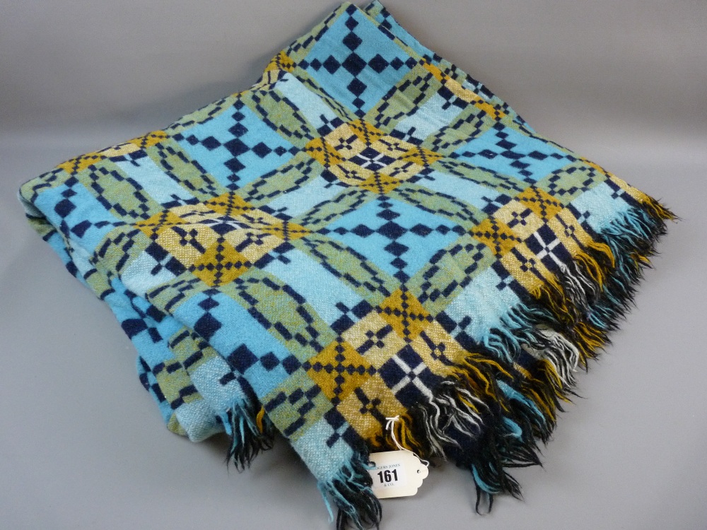 A LARGE BLUE PATTERNED WELSH WOOLLEN BLANKET