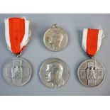 A 1934 ADOLF HITLER MEDALLION and three German medals, the medallion marked to the back '