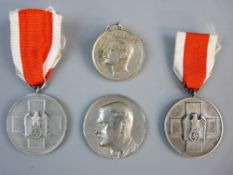 A 1934 ADOLF HITLER MEDALLION and three German medals, the medallion marked to the back '