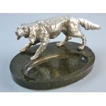 A GOOD WHITE METAL HUNTING DOG on an oval black mineral ashtray base