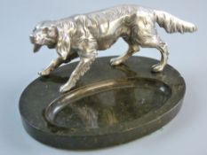 A GOOD WHITE METAL HUNTING DOG on an oval black mineral ashtray base