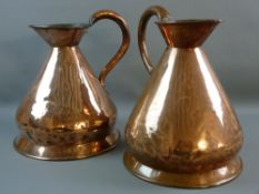 A PAIR OF ANTIQUE TWO GALLON COPPER BEER MEASURES, 34 cms high