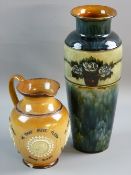 A ROYAL DOULTON STONEWARE VASE AND JUG, the slender baluster shaped vase with flared rim and a