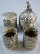 FOUR WHITE METAL INDIAN/BURMESE PIECES being a pair of spillholders, a cylindrical pot and cover and