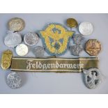 A COLLECTION OF GERMAN TINNIES AND POLICE BADGES, nine various propaganda badges including Adolf