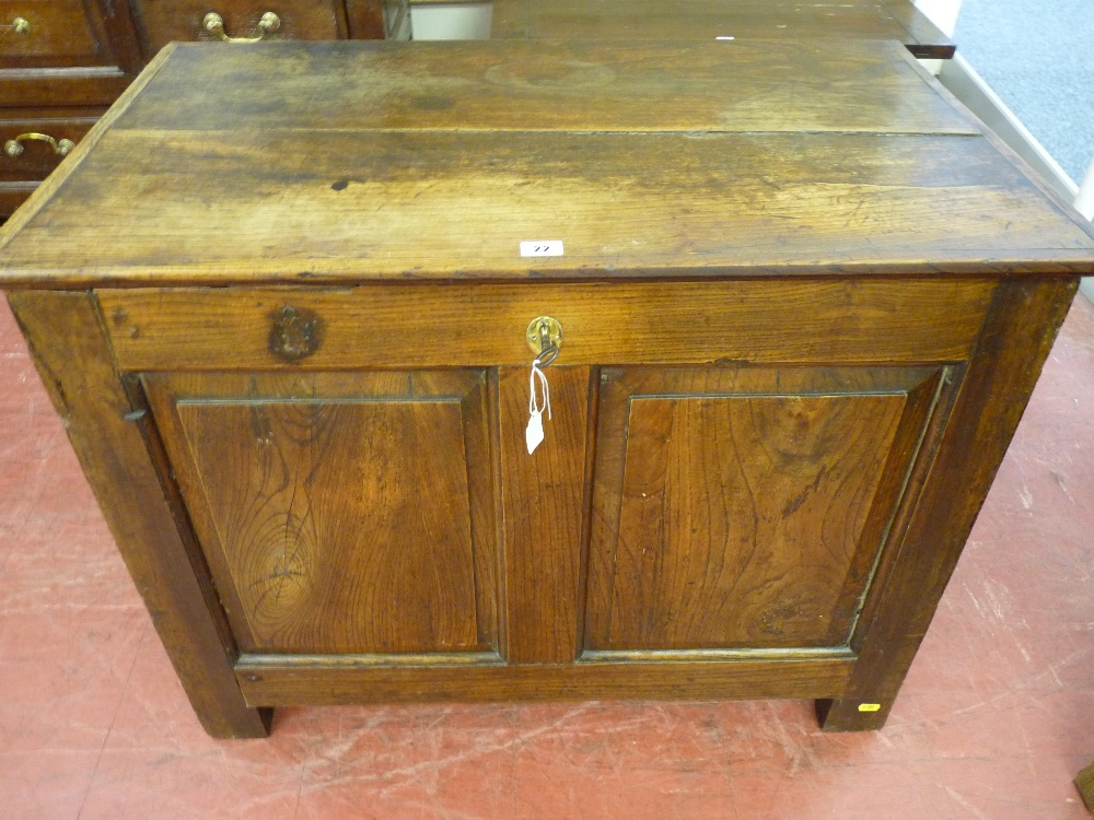 AN 18th CENTURY OAK COFFER of small proportions, the front having two fielded panels and end fielded