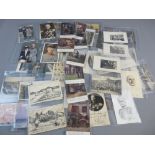 SIXTY PLUS LATE 19th/EARLY 20th CENTURY GERMAN POSTCARDS showing uniformed individuals and groups,