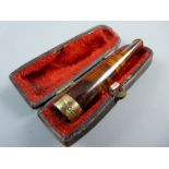 A CASED AMBER CIGARETTE HOLDER with nine carat gold band, Chester 1898