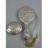 A SILVER BACKED OVAL DRESSING MIRROR with bevelled glass, Birmingham 1897, a circular silver lid