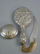 A SILVER BACKED OVAL DRESSING MIRROR with bevelled glass, Birmingham 1897, a circular silver lid