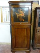 A WARING & GILLOW MAHOGANY AND CROSSBANDED ONE PIECE STANDING CORNER CUPBOARD having a stepped