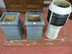 A PAIR OF SQUARE POTTERY CHIMNEY POTS, 32 x 52 cms and a circular chimney pot, 77 cms high