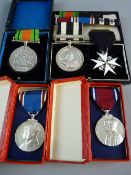 A GROUP OF FIVE PRE 1950s AWARDS AND MEDALS to include a GV & Queen Mary Jubilee in original box,