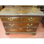 AN EARLY 19th CENTURY OAK CHEST OF DRAWERS having two long and two short drawers with brass swan