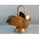 A CIRCULAR BASED COPPER HELMET COAL SCUTTLE with swing handle and brass end handle