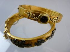 TWO WWI GERMAN PATRIOTIC TRENCH ART BANGLES, gilt metal with leaf and iron cross decoration, one