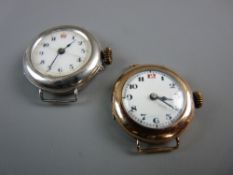 A LADY'S NINE CARAT GOLD CASED WRISTWATCH and a silver cased lady's wristwatch (no straps), both