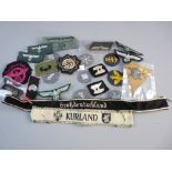 A COLLECTION OF WEHRMACHT UNIFORM BADGES AND INSIGNIA, trade badges and sleeve titles etc along with