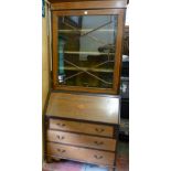 AN EDWARDIAN MAHOGANY AND CROSSBANDED BOOKCASE BUREAU having a scrolled pediment over a single