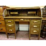 A GOOD TWIN PEDESTAL ROLL TOP DESK having a tambour cylinder desk top with fitted interior of