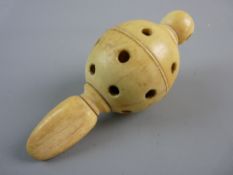AN ANTIQUE IVORY BABY'S RATTLE with teether, 11 cms long