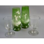 A PAIR OF GREEN MARY GREGORY TAPERED GLASS VASES, the paintwork of a little hatted boy by a tree, 20