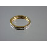 A NINE CARAT GOLD DIAMOND ETERNITY RING with thirty two tiny diamonds plus one missing, 2.3 grms tot