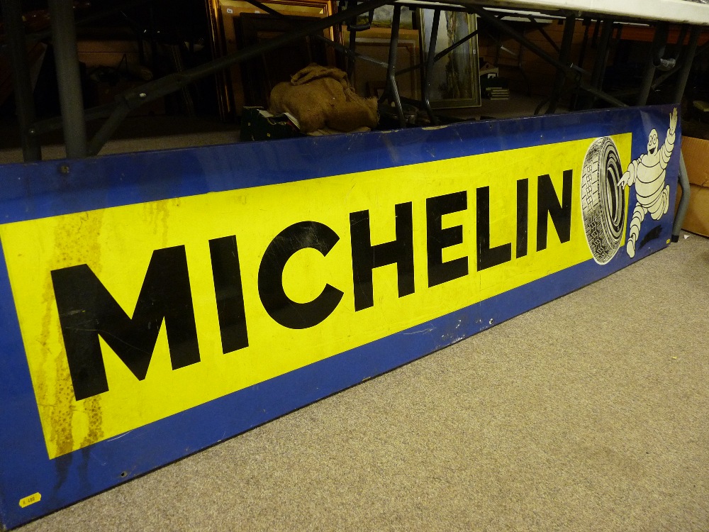 MICHELIN TYRES SIGN, rectangular lithograph and enamelled showing image of 'Bidendum', 46 x 197 cms