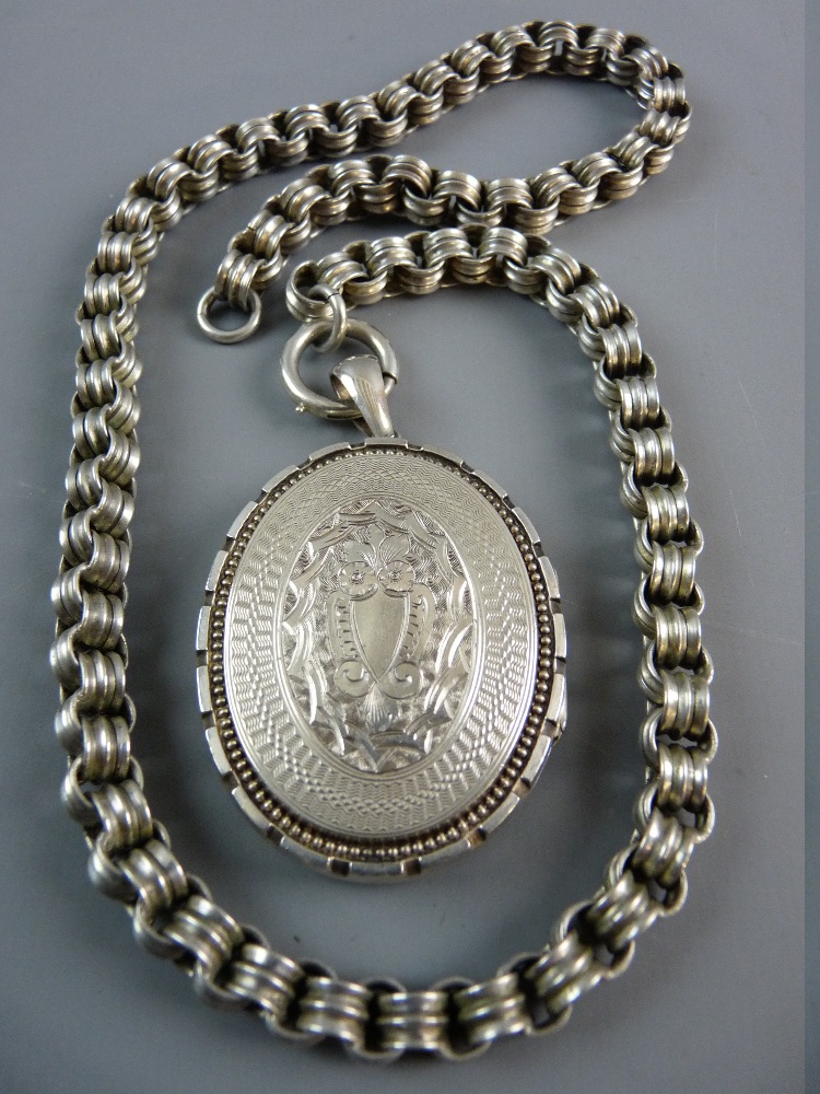 A LARGE OVAL WHITE METAL BRIGHT CUT PHOTO LOCKET and link chain