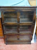 A THREE TIER SIMPOLES CHAPTER STYLE POLISHED BOOKCASE