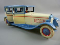 A LARGE 20th CENTURY TINPLATE CLOCKWORK SALOON CAR, marked 'DBS 540 Baron' with balloon tyres, fixed