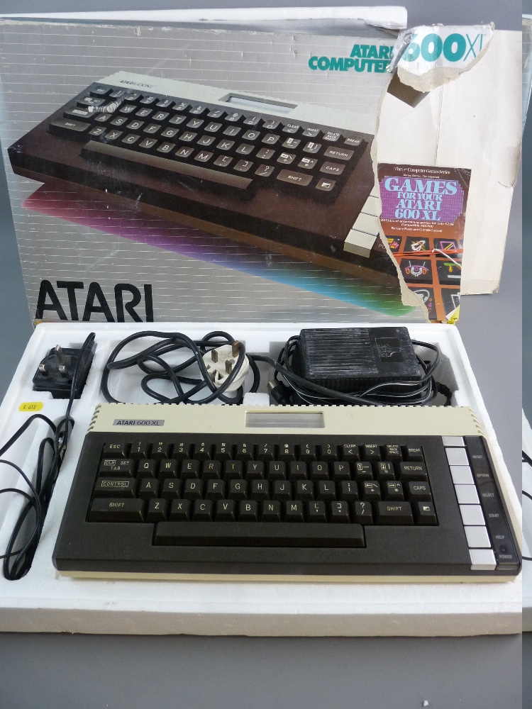 AN ATARI 600XL COMPUTER in original packaging and box along with two 'Games for Your Atari' books