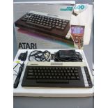 AN ATARI 600XL COMPUTER in original packaging and box along with two 'Games for Your Atari' books