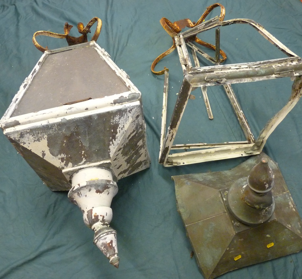 A PAIR OF COPPER STREET LAMP TOPS, each of four glass panels of tapered shape and with shaped and