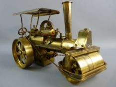 A BRASS MODEL STEAM TRACTION ENGINE, chain steered model with steam roller front, marked to the base