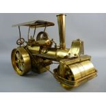 A BRASS MODEL STEAM TRACTION ENGINE, chain steered model with steam roller front, marked to the base