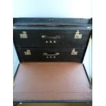 A VINTAGE CAR LUGGAGE TRUNK by Dunhills of London having clip fasteners and central lock, drop