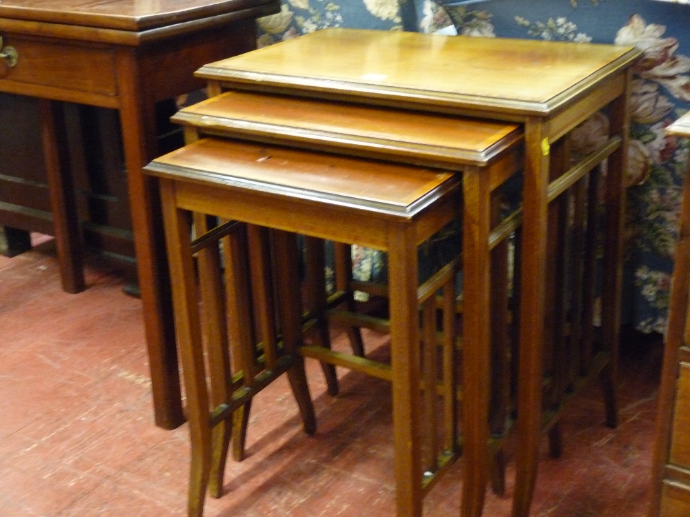 A SET OF THREE EDWARDIAN CROSSBANDED AND INLAID MAHOGANY TABLES having square galleried sides and