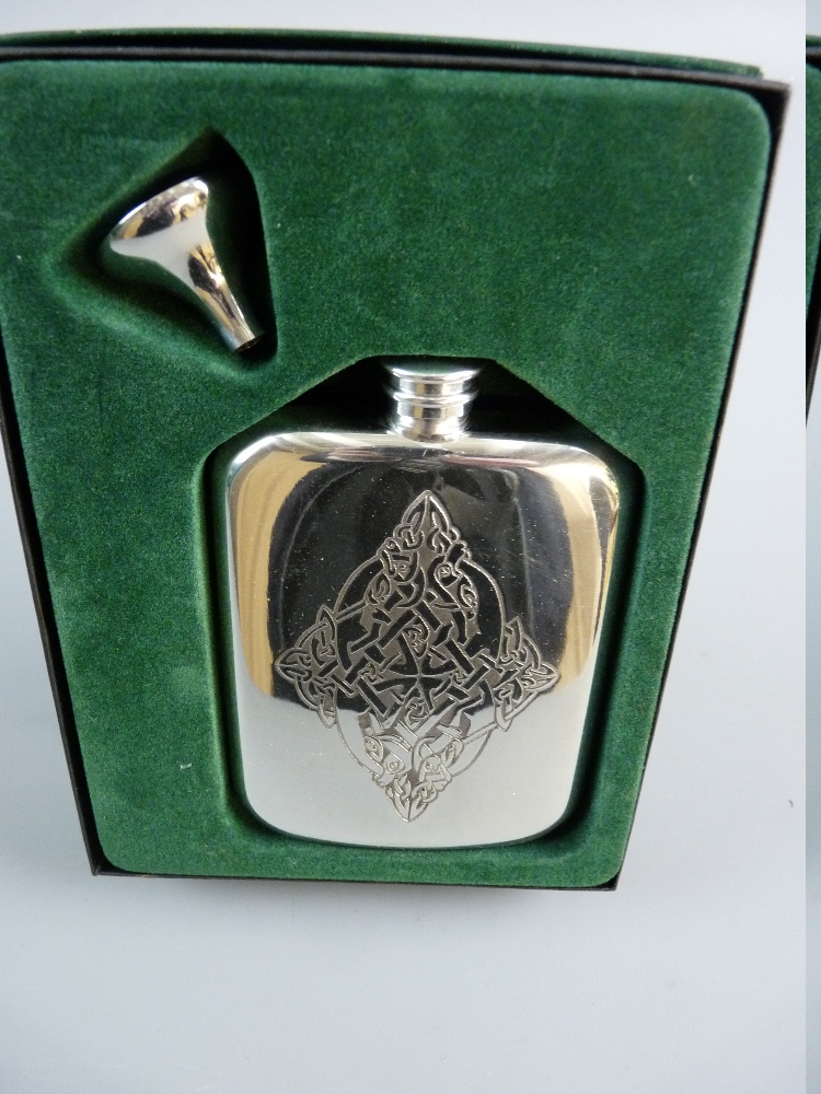 A BOXED ELECTROPLATED SCOTTISH MADE HIP FLASK with Celtic style decoration complete with funnel