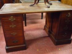 AN EDWARDIAN MAHOGANY TWIN PEDESTAL KNEEHOLE DESK, 130 cms wide