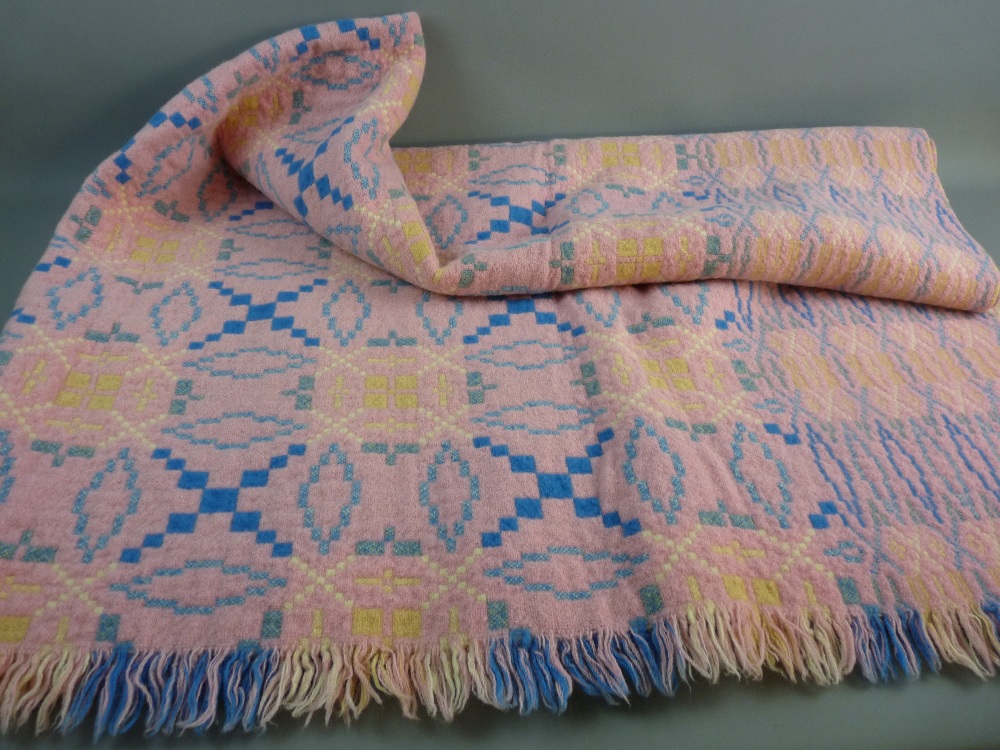 A LARGE PINK PATTERNED WELSH WOOLLEN BLANKET