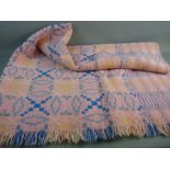 A LARGE PINK PATTERNED WELSH WOOLLEN BLANKET